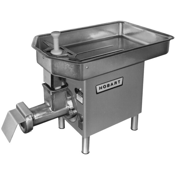 A Hobart meat chopper with a metal pan.
