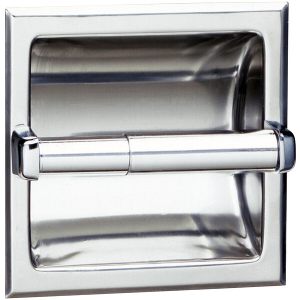 A close-up of a silver Bobrick recessed toilet paper holder.