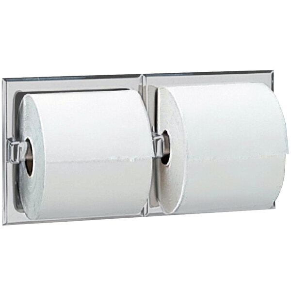 A Bobrick recessed double toilet tissue dispenser with two rolls of toilet paper.