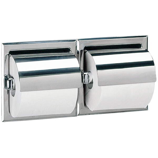 A close-up of a Bobrick stainless steel recessed double toilet paper holder with a bright polish finish.