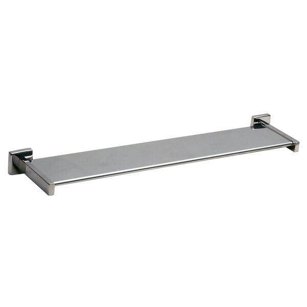 A silver rectangular Bobrick surface-mounted toiletry shelf with metal brackets.