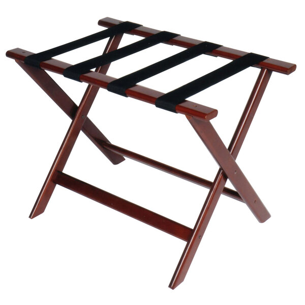 A Cherry mahogany wood CSL Deluxe Series luggage rack with black straps.
