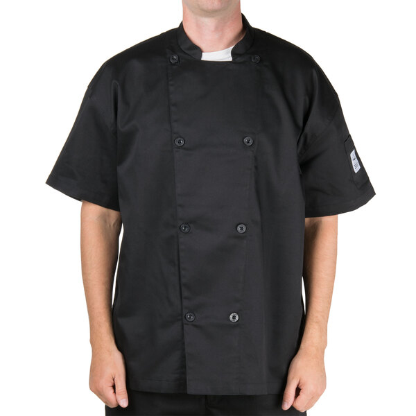 A man wearing a black Chef Revival chef jacket with mesh back.
