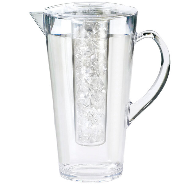 A clear pitcher with ice inside.
