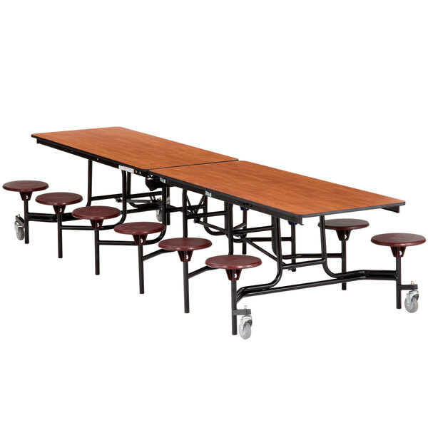 A National Public Seating rectangular cafeteria table with stools attached.