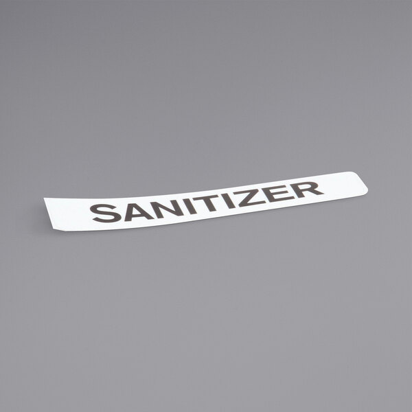 A white rectangular Champion sanitizer label with black text.