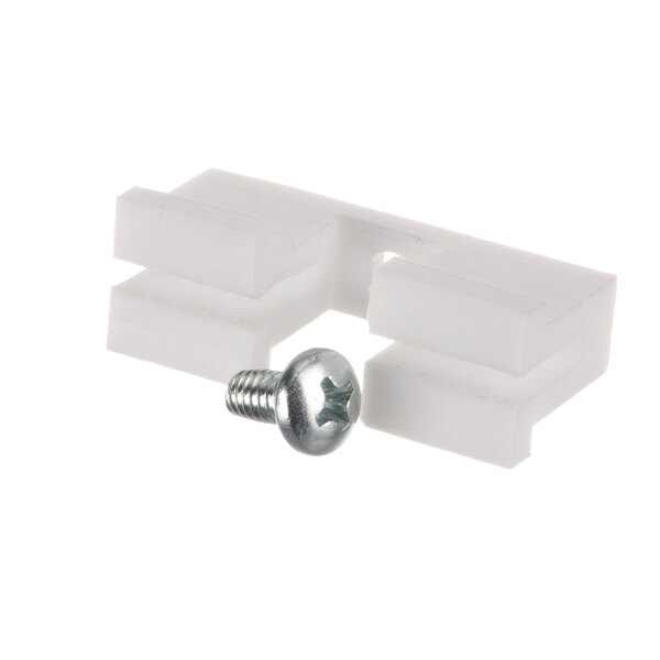 A close-up of a white plastic piece with a screw in it.
