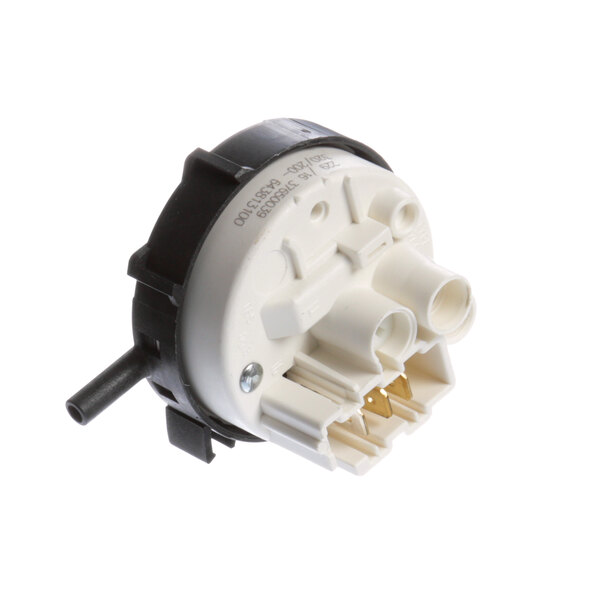 A close-up of a white and black Electrolux pressure switch.
