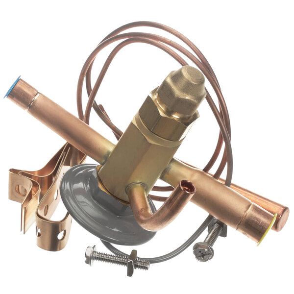 A close-up of a copper Master-Bilt expansion valve.