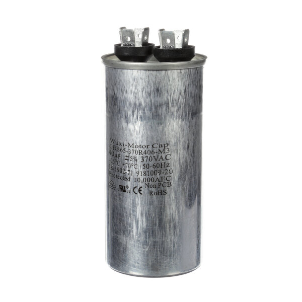 A round metal Ice-O-Matic run capacitor with black caps.