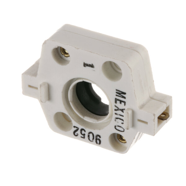 A white plastic Imperial switch with black text and a hole.