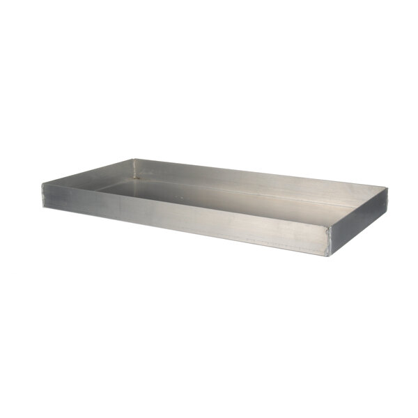 A metal tray with a handle on a counter.