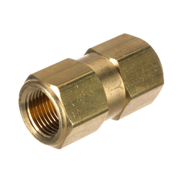 A gold metal nut with brass threading.