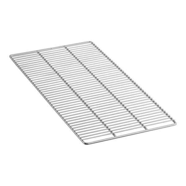 A stainless steel metal grate with holes.