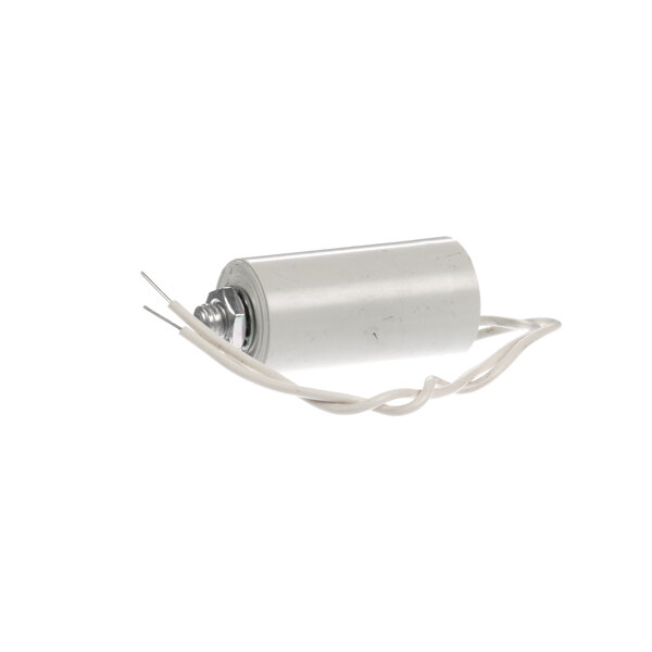 A close up of a white cylindrical Victory CAPACITOR040 with a wire.