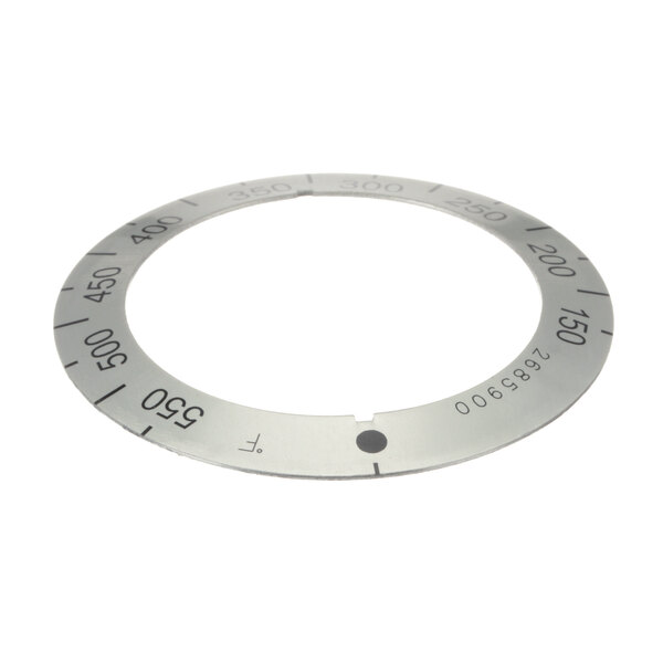 A white circular metal dial insert with numbers for a Garland US Range.