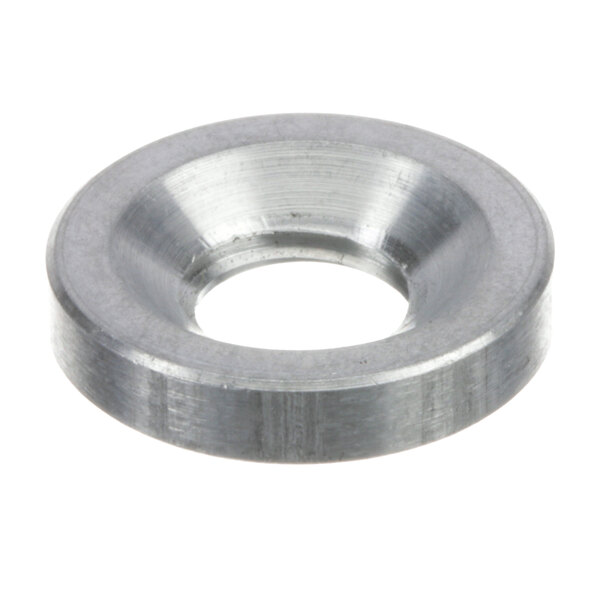 A close-up of a Mannhart stainless steel spacer with a hole in it.
