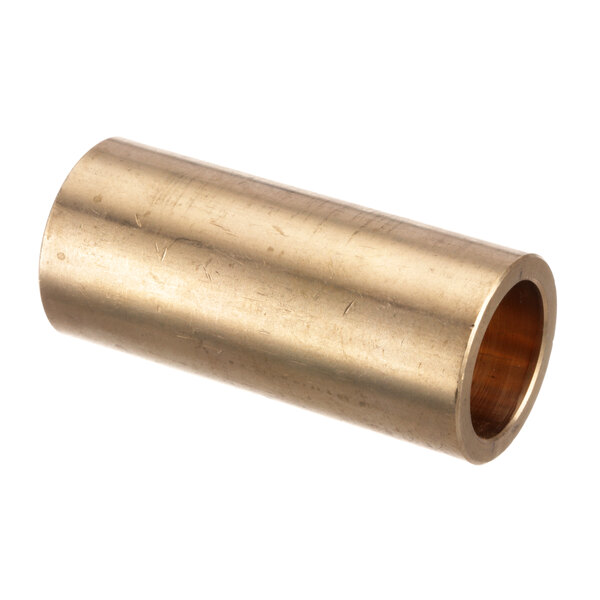 A close-up of a brass bushing with a hole in it.