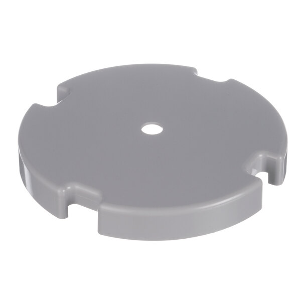 A grey plastic circular disk with holes.