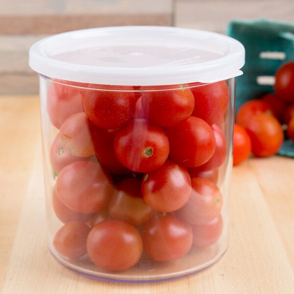A Cambro clear plastic crock with tomatoes in it.
