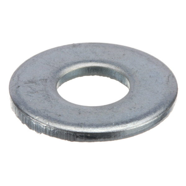 A close-up of a metal washer with a round hole.