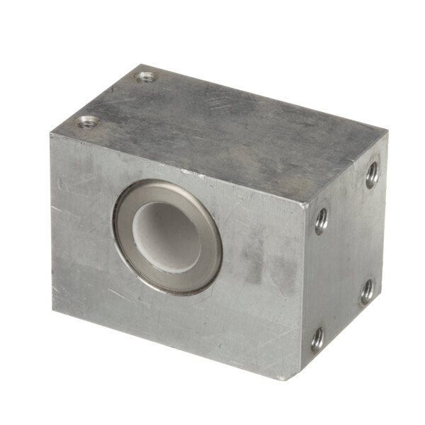 A metal block with a hole in the middle.