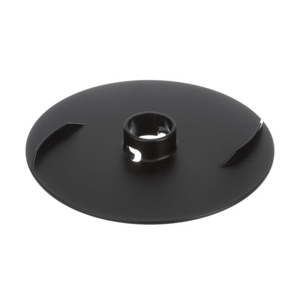 A black circular plate with a hole in it.