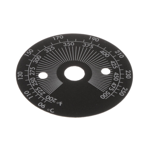 A circular black thermostat decal with white text.