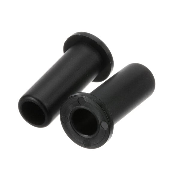 A close-up of a pair of black plastic plugs.