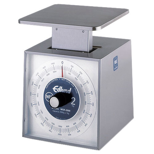 A stainless steel Edlund metric portion scale with a digital display.