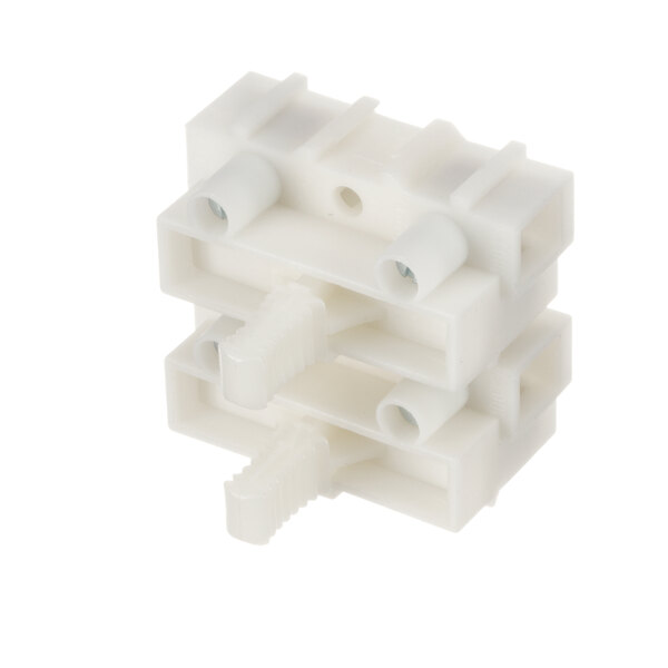A white plastic block with two holes.