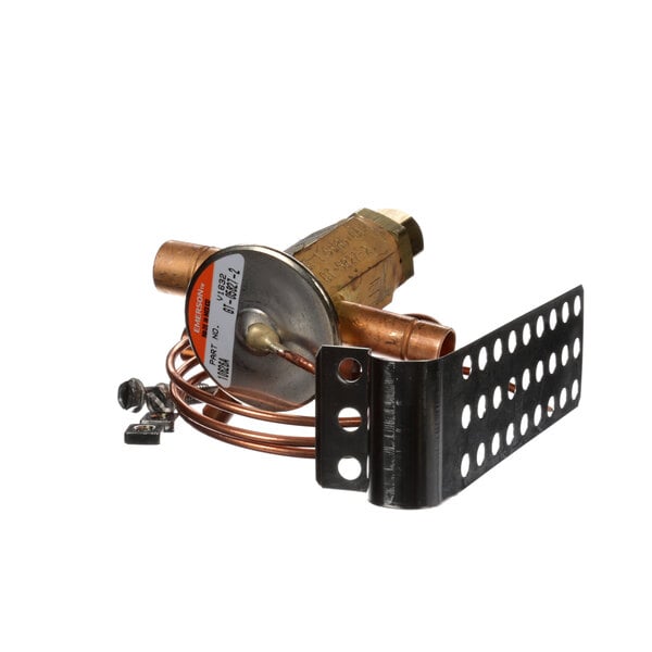 A Kolpak expansion valve with a copper pipe and wire attached to it.
