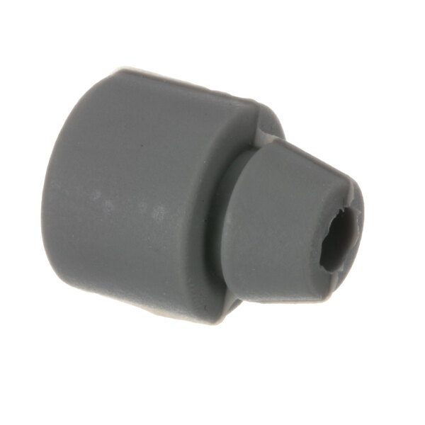 A grey plastic plug with a hole.