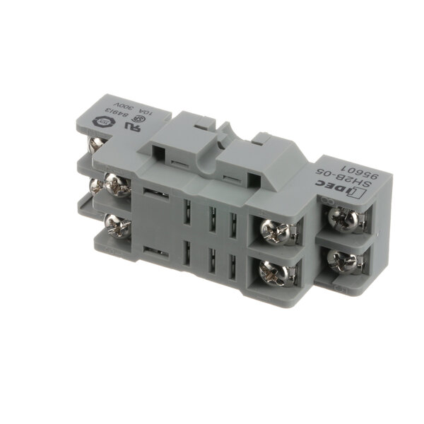 A grey electrical device with silver screws, a Champion 111036 relay socket.