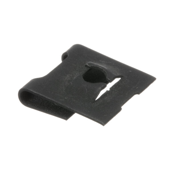 A close-up of a black plastic Fetco nut clip with a hole in it.