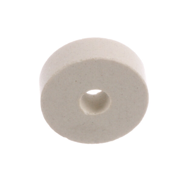 A white round object with a hole in the center.