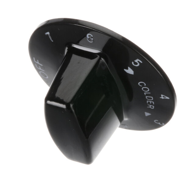 A close-up of a black Beverage-Air control knob with white numbers.