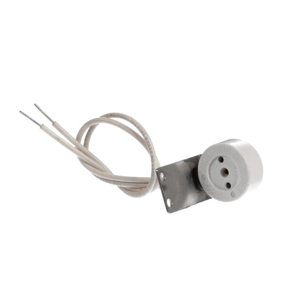 A close-up of a white True Refrigeration stationary socket with a wire attached.