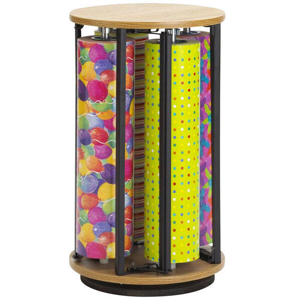 A Bulman Suzette revolving vertical rack filled with colorful wrapping paper rolls.