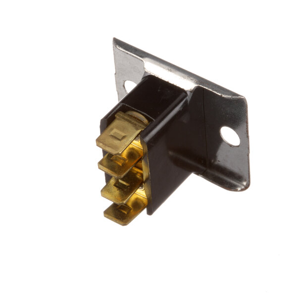 A black and gold Master-Bilt terminal block with metal prongs.