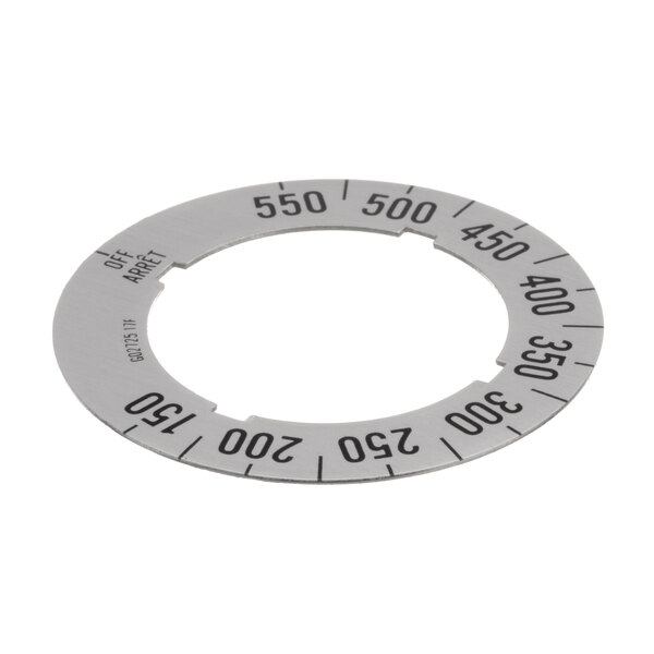A circular metal dial insert with numbers on it.