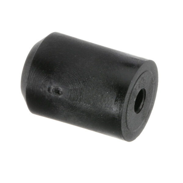 A black plastic cylinder with a hole in it.