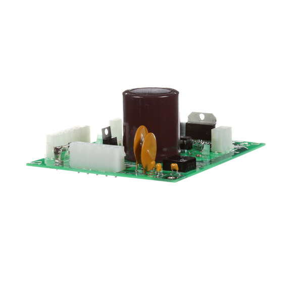 A green circuit board with a brown cylinder and white buttons.