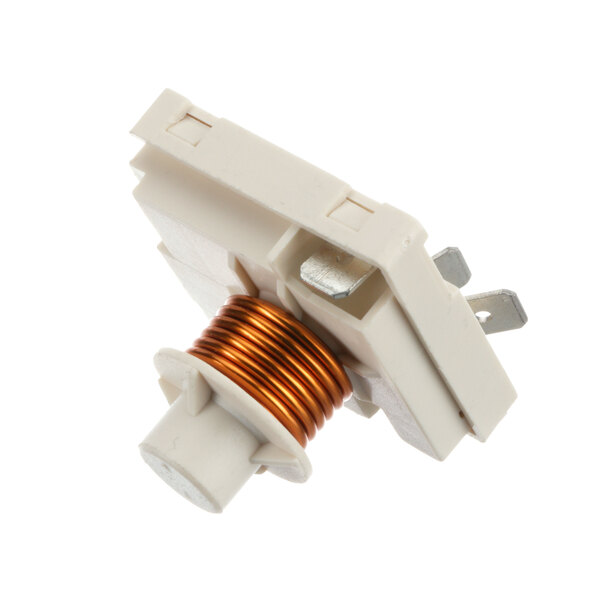 A white electrical device with a copper coil and an orange and white wire connector.