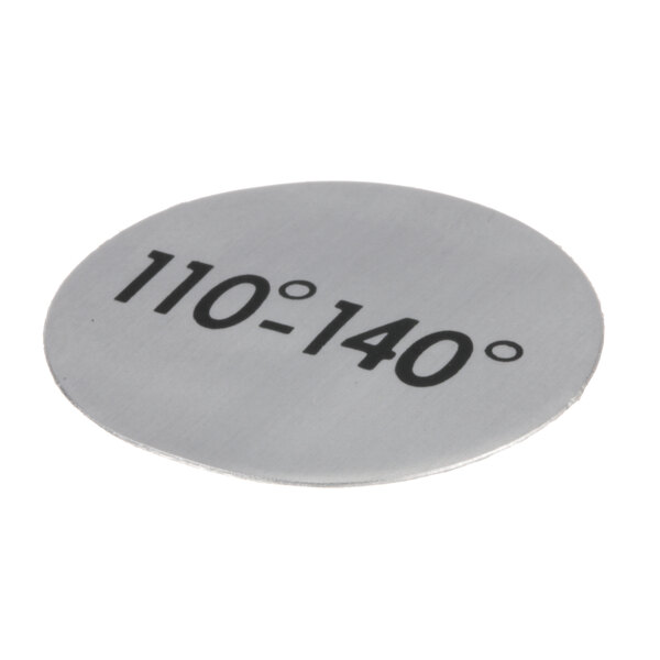 A close-up of a circular silver metal plate with black numbers reading "10 - 140"