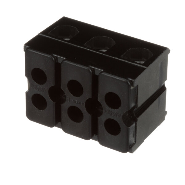 A black Groen terminal block with four holes.