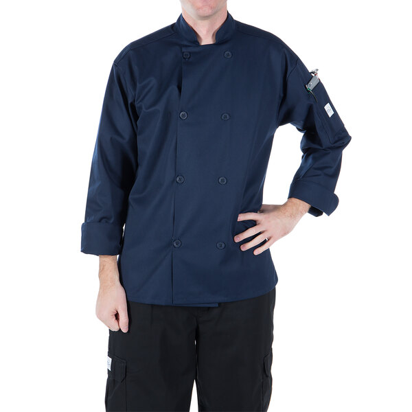 A man wearing a navy Mercer Culinary chef jacket with long sleeves.