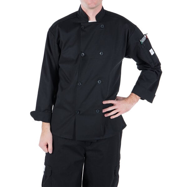 A man wearing a Mercer Culinary black chef coat with long sleeves.