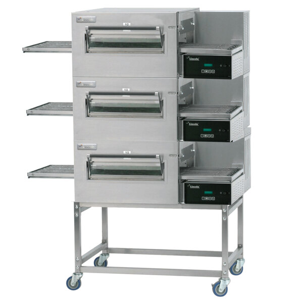 A Lincoln Impinger triple conveyor oven with three belts.
