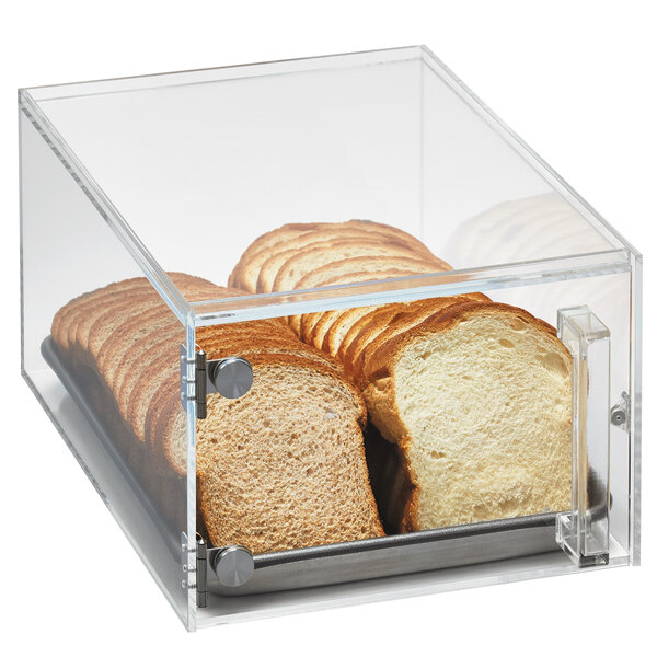 A clear plastic box with sliced bread inside on a counter in a bakery display.